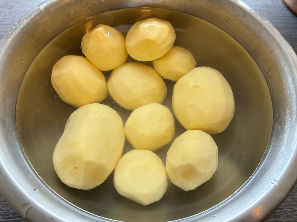 Peeled potatoes in water